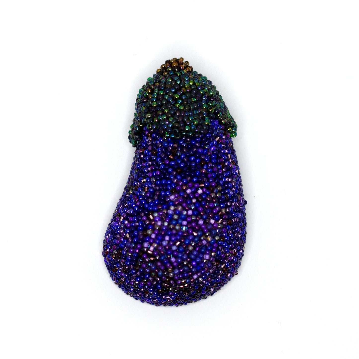 Handmade beaded purple eggplant brooch on a white background.