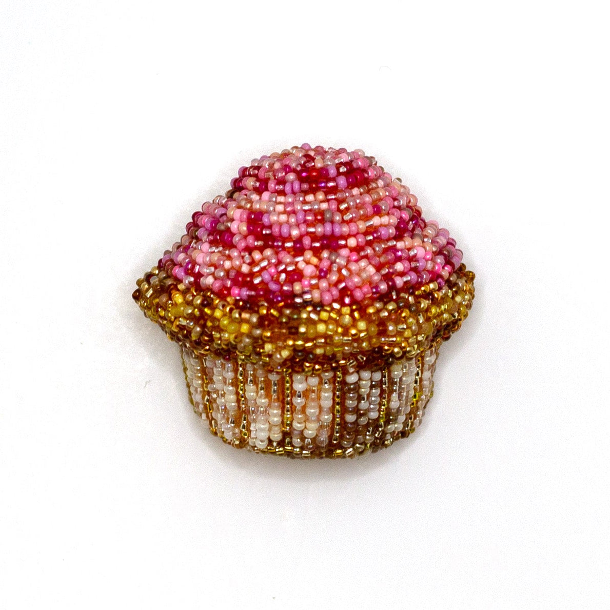 Handmade beaded pink frosted cupcake brooch on a white background.