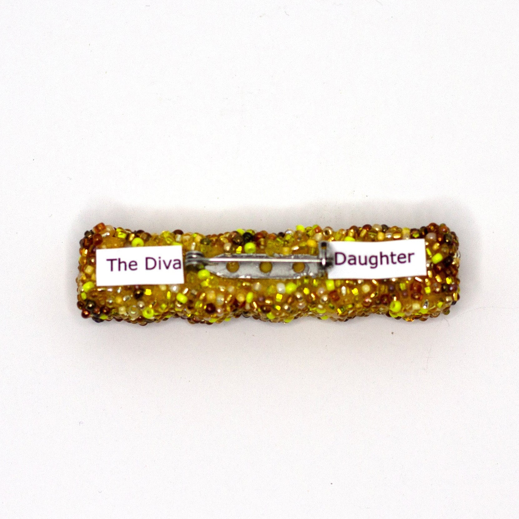 Back view of a handmade beaded French fry brooch on a white background showing pin fastener.