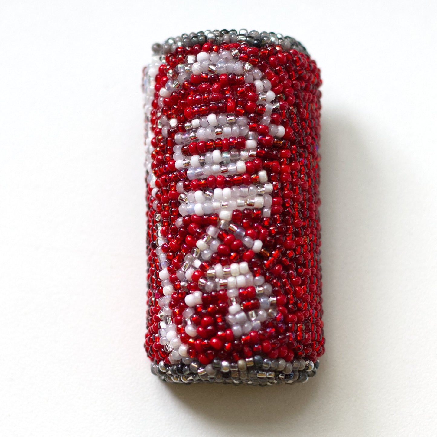 Beaded Coke pop can brooch shown on a white background.
