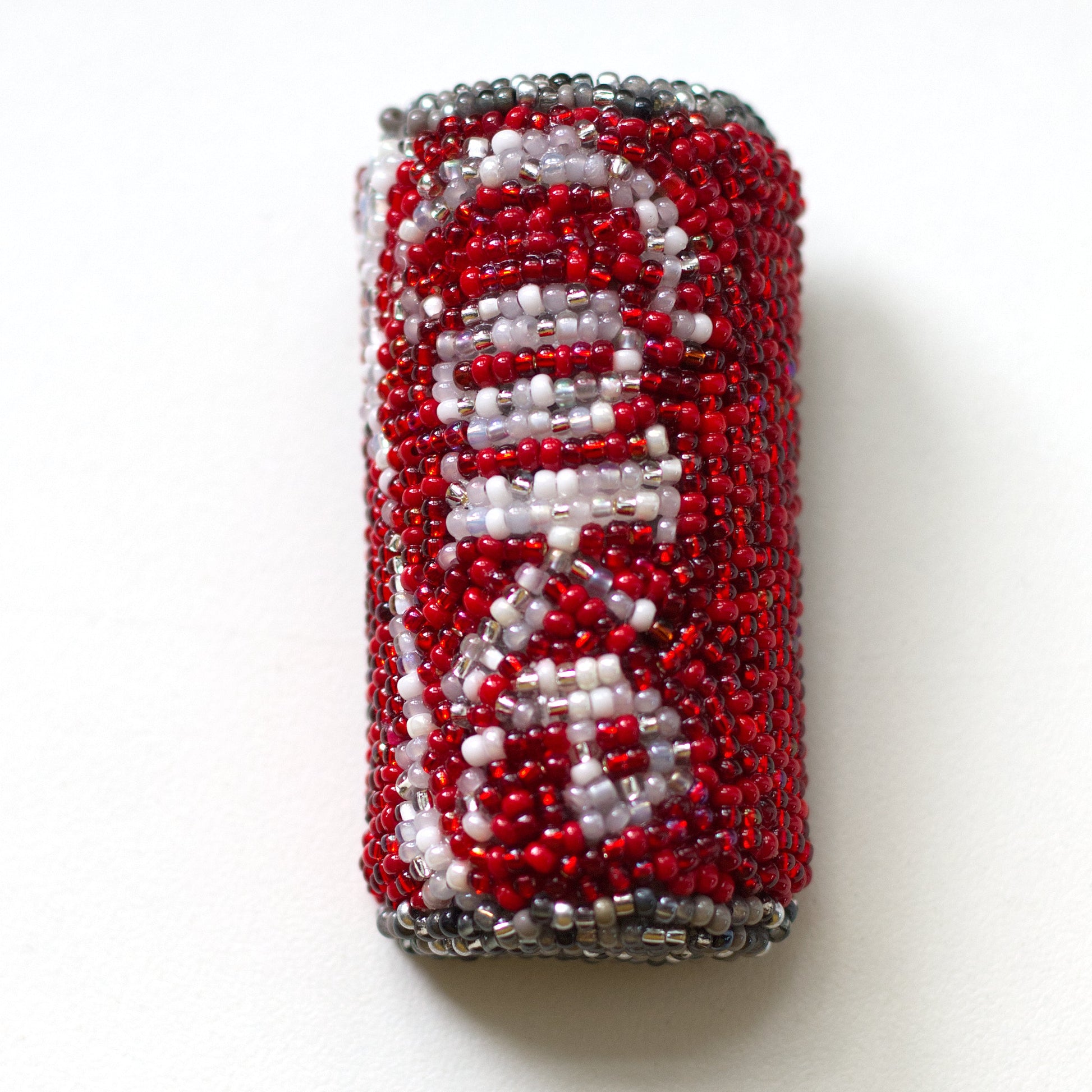 Beaded Coke pop can brooch shown on a white background.