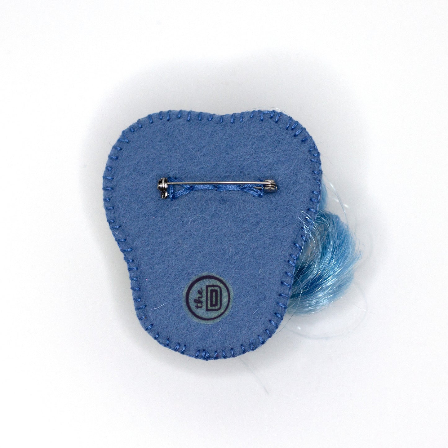 Back view of a handmade beaded brooch featuring Lemony Gem My Little Pony on a white background showing pin fastener.