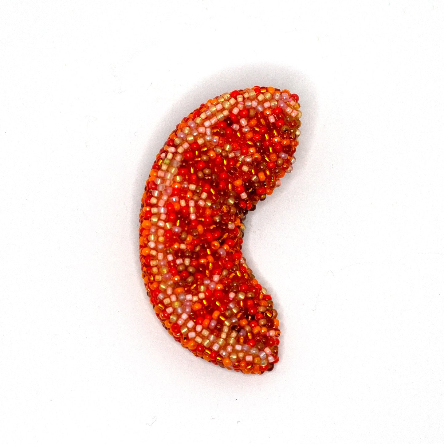 Handmade beaded orange slice brooch shown on a white background.