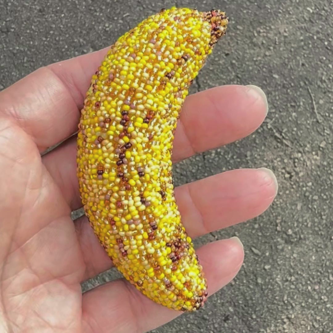 Video showing a bruised banana brooch shot outside to show off the bead sparkle.