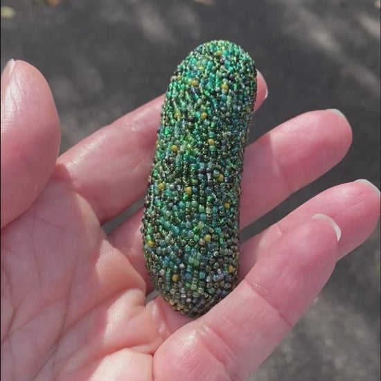 Video of a beaded pickle brooch taken in the sunlight to show off the sparkle.