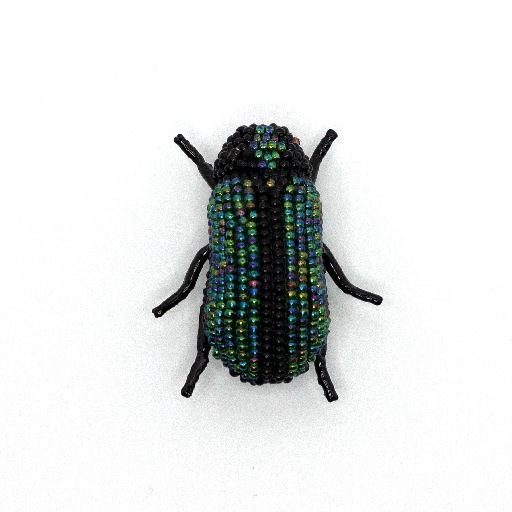 Green and black handmade beaded beetle brooch shown on a white background.
