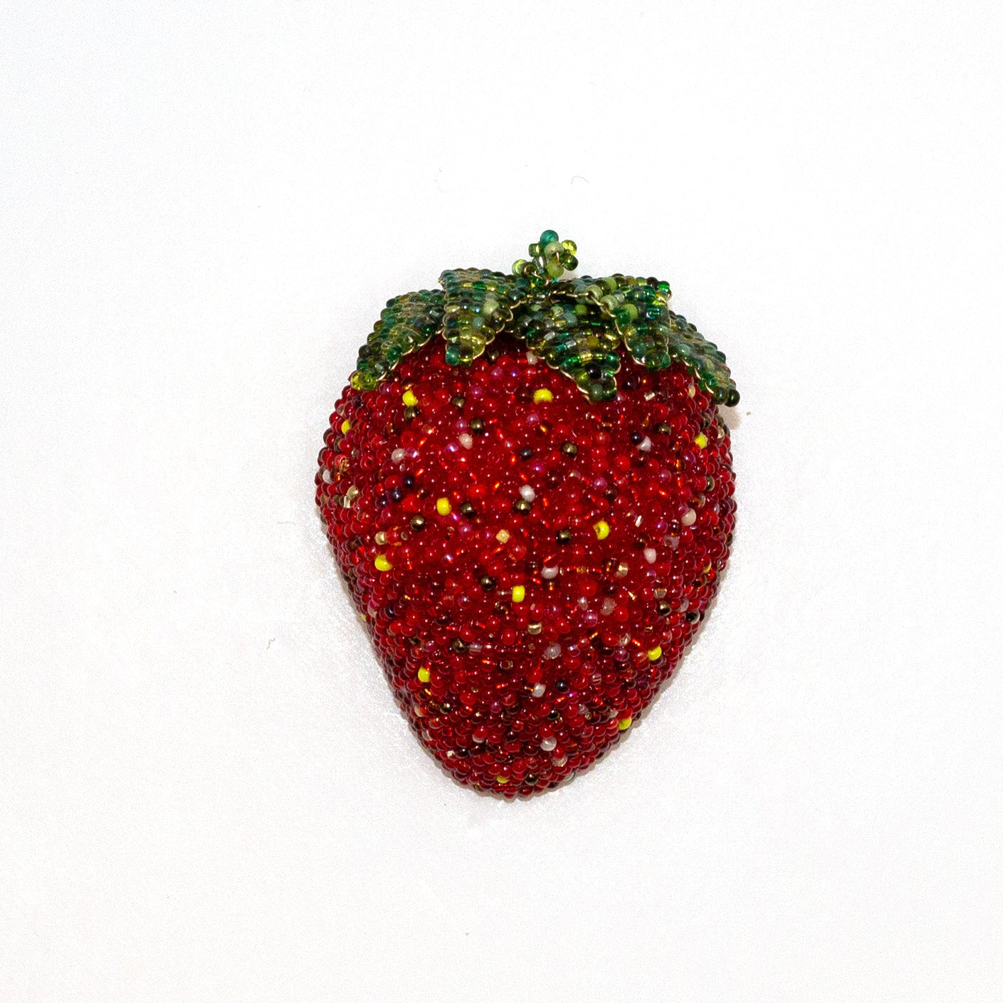 Handmade beaded strawberry brooch shown on a white background.