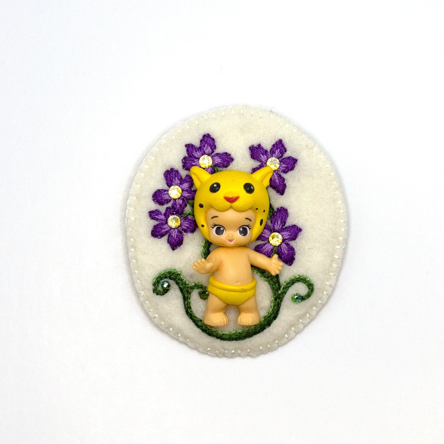 Handmade embroidered floral brooch featuring Lippy Twozie shown on a white background.
